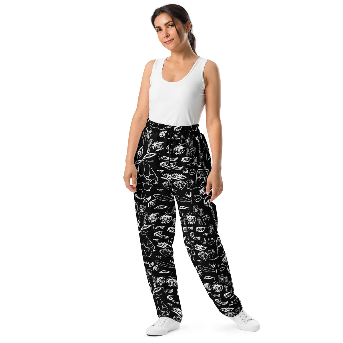 Model wearing the Doodle wide-leg joggers in White on Black, front view