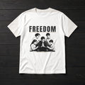 Flat white tee with an engraved illustration of a father kneeling in prayer with his wife and three children and a FREEDOM headline