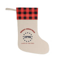 Merry Christmas 1776 rustic stocking with red and black buffalo-plaid cuff, thirteen stars and Land of the Free