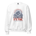 White crewneck sweatshirt with a navy woodcut crown sinking into ocean waves under red rays, printed It's Not Us. It's You. Signed, The Thirteen.