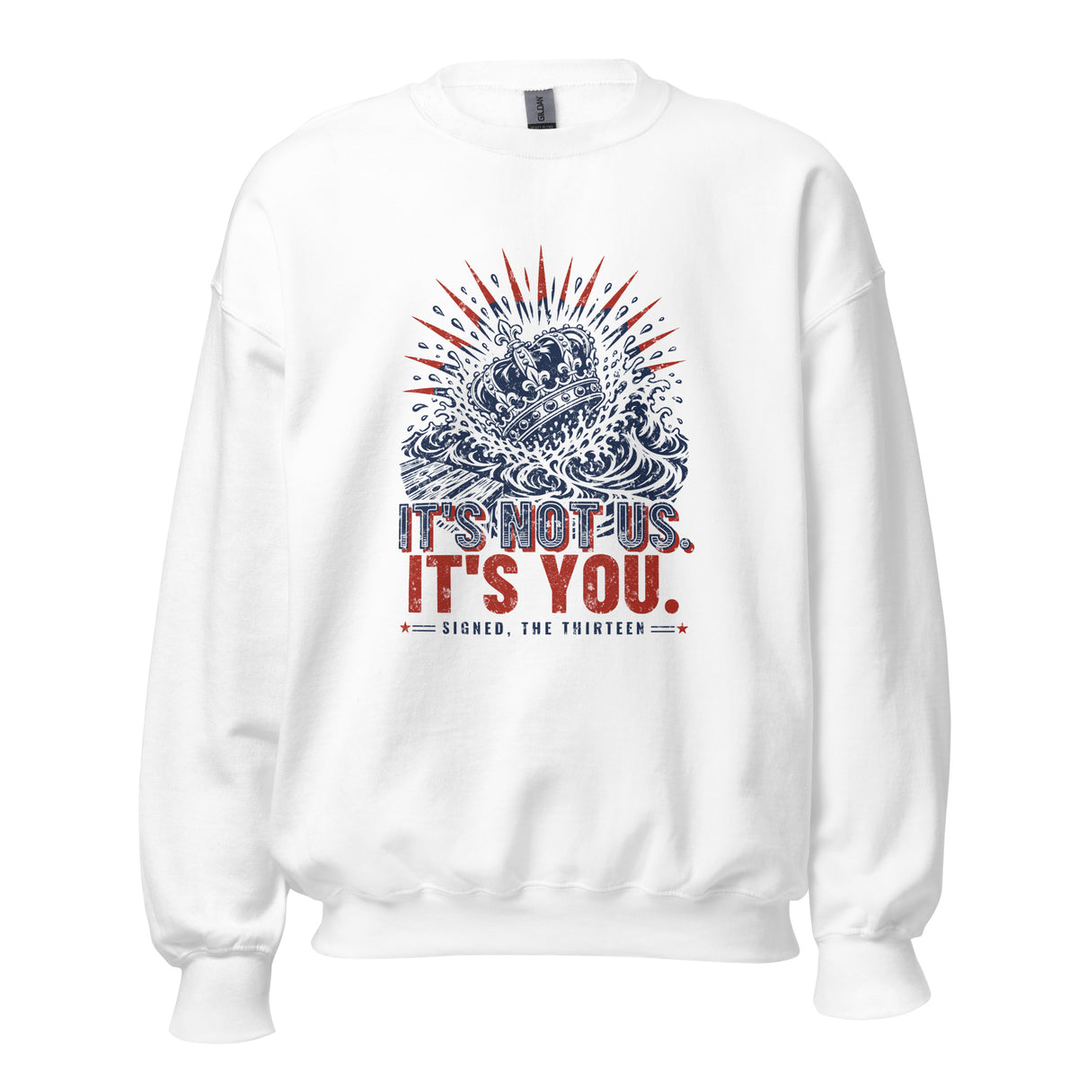 White crewneck sweatshirt with a navy woodcut crown sinking into ocean waves under red rays, printed It's Not Us. It's You. Signed, The Thirteen.