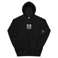 Quarter Millennial black hoodie, front: small chest print of a colonial patriot with flag and sleeve badge