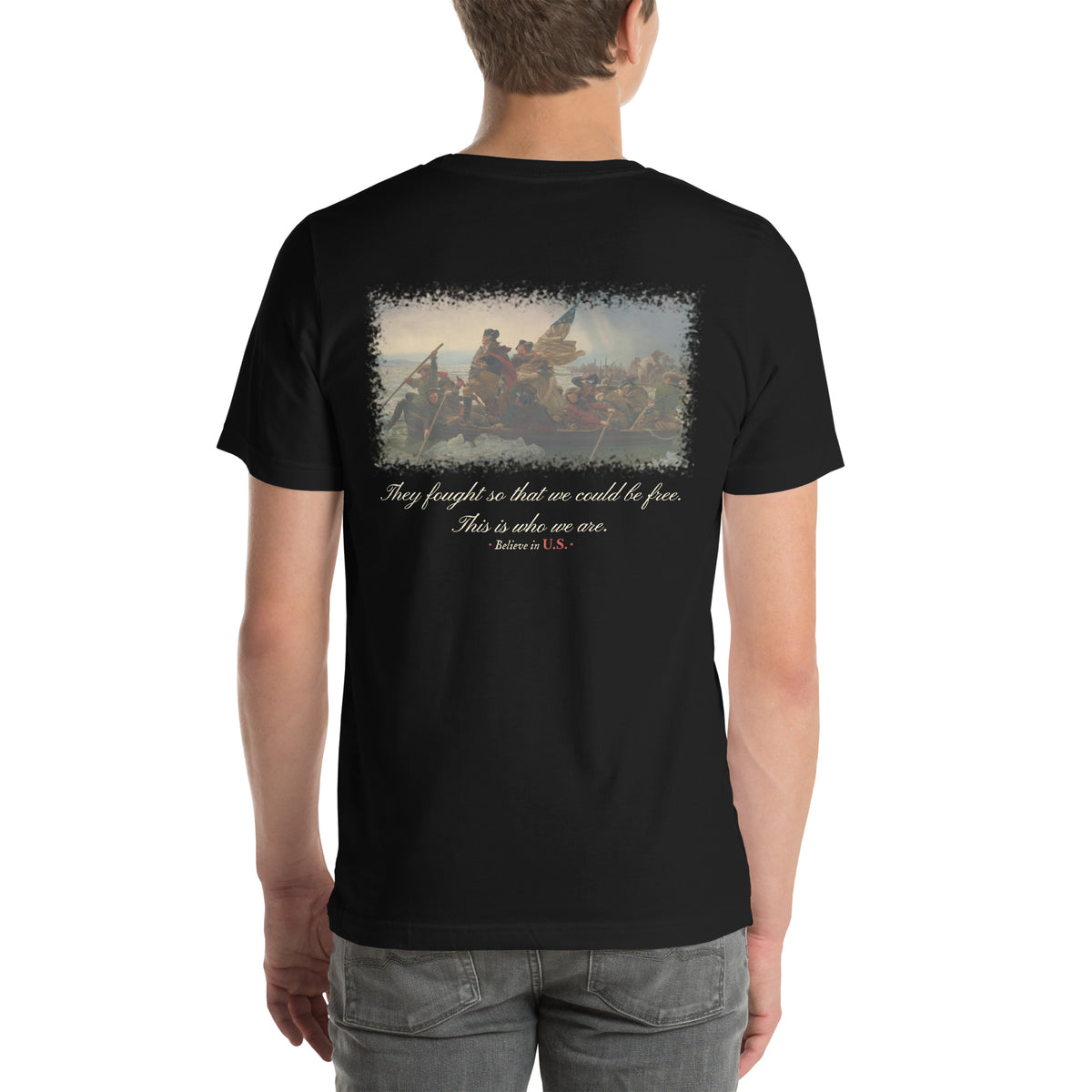 Back of the black Believe in U.S. tee on a model: Washington Crossing the Delaware print above the line They fought so that we could be free. This is who we are.