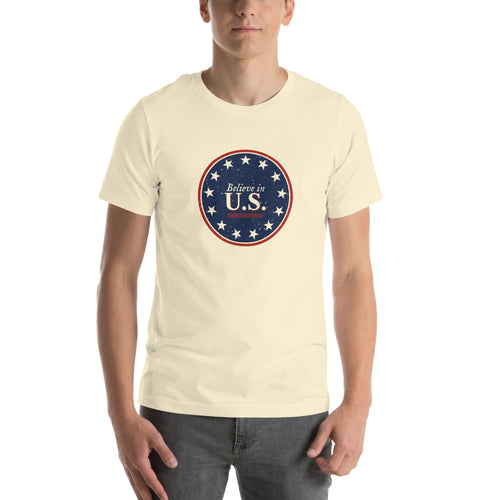 Man wearing the natural Believe in U.S. tee with the 13-star colonial canton seal on the chest