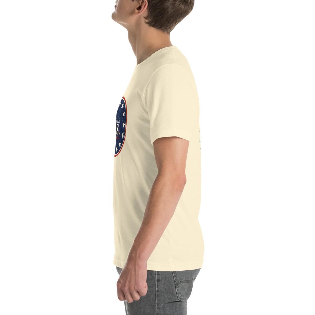 Left side view of the natural Believe in U.S. tee